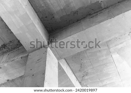 Abstract concrete construction background, ceiling with girders and square pillar
