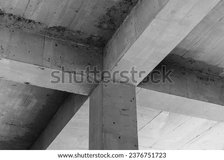 Abstract concrete interior background, ceiling construction with girders and square pillar