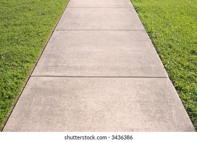 Abstract Of Concrete Sidewalk And Grass