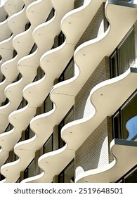 abstract concrete wave shape patterns in building exterior architecture