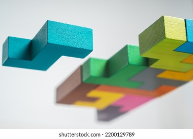 Abstract construction from wooden blocks. Colorful wooden building blocks. The concept of logical thinking.	 - Shutterstock ID 2200129789