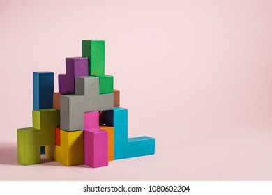 Abstract Construction From Wooden Blocks Tetris Shapes. The Concept Of Logical Thinking, Geometric Shapes.