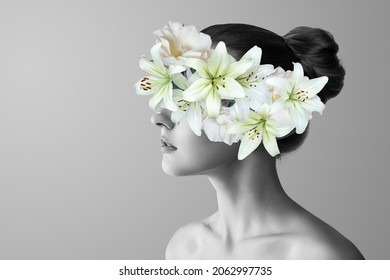Abstract contemporary art collage black and white portrait of young woman with flowers on face hides her eyes