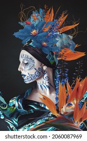 Abstract contemporary art collage portrait of young woman with flowers and body art paint on her face