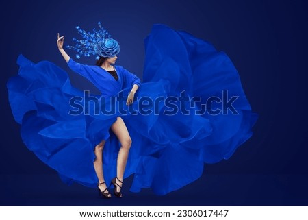 Abstract contemporary surreal art collage portrait of young dancing woman in long fluttered on the wind dress with flowers