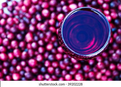 Abstract Of Cranberry Juice With Fresh Berries. Shallow Depth Of Field With Selective Focus On Glass.