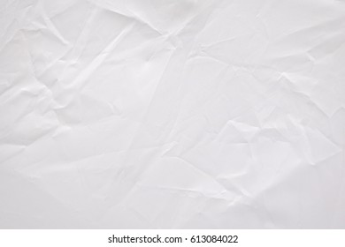 Abstract creased fabric texture background. Crumpled white textile material pattern.