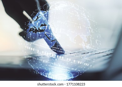 Abstract creative coding concept with world map and hands typing on laptop on background. Multiexposure