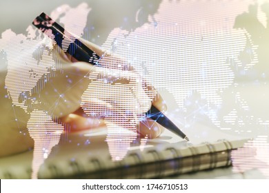 Abstract creative digital world map and woman hand writing in diary on background, globalization concept. Multiexposure