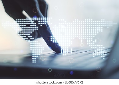 Abstract creative digital world map and hands typing on laptop on background, globalization concept. Multiexposure