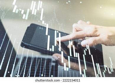 Abstract creative financial graph with finger clicks on a digital tablet on background, financial and trading concept. Multiexposure - Shutterstock ID 2222154011