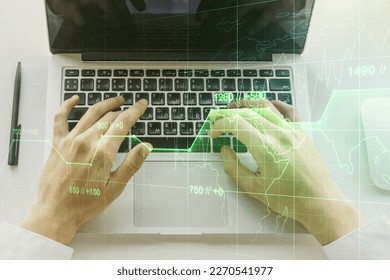 Abstract creative stats data concept with hands typing on laptop on background. Multiexposure