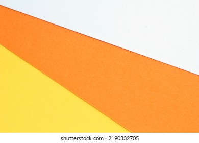 Abstract Creative Texture Geometric Candy Corn Pattern Craft Paper Background. White, Orange, Yellow Colors. Halloween Autumn Holiday Concept. Top View With Copy Space For Text, Flat Lay, Close-up