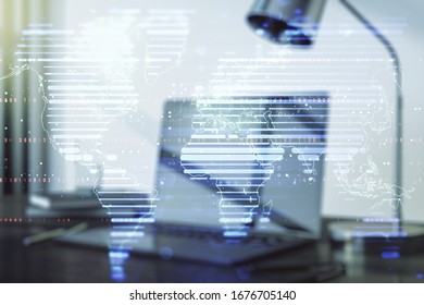Abstract creative world map on modern laptop background, international trading concept. Multiexposure