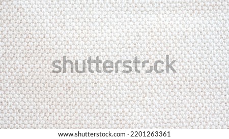 
Abstract crochet woven canvas cotton fabric white texture  background.
Natural linen cloth weave seamless pattern. close up. top view.