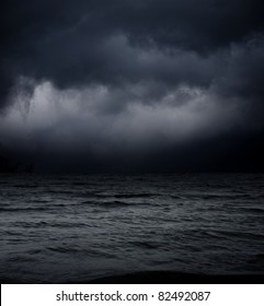 Abstract Dark Background. Sea Waves Against The Black Sky