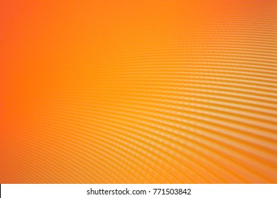 An abstract dark orange background with Golden waves, interference, moire
