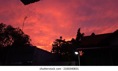 Abstract Dark Red Cloud Background With Building Silhoutte. Dramatic Fiery Bloody Sky.