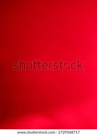 Abstract deep red gradient background with subtle light leaks.