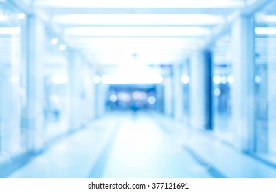 Abstract Defocused Blurred Background, Empty Business Corridor Or Shopping Mall. Medical And Hospital Corridor Defocused Background With Modern Laboratory (clinic)