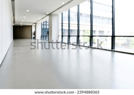 Abstract defocused blurred background of empty long corridor in the modern hospital.