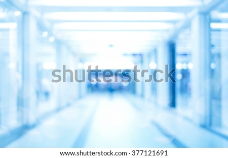 abstract defocused blurred background, empty business corridor or shopping mall. Medical and hospital corridor defocused background with modern laboratory (clinic)