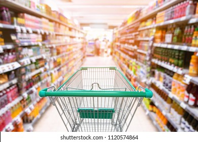 Abstract Defocused Blurred of Consumer Goods and Shopping Cart in Supermarket Store, Shop Trolley Basket in Department Store. Business Retail and Customer Shopping Mall Service, Convenience Concept. - Shutterstock ID 1120574864