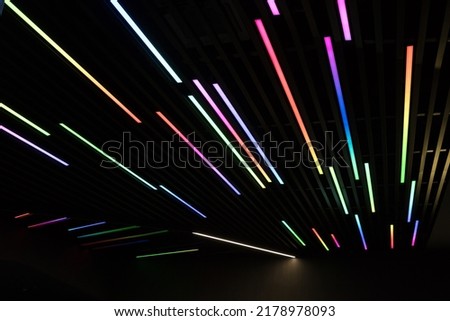 Abstract defocused colourfull background - different lines on black
