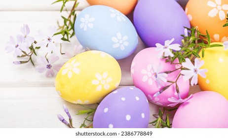 Abstract Defocused Easter Scene - Ears Bunny Behind Grass And Decorated Eggs In Flowery Field
