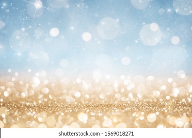 Abstract Defocused Gold And Blue Glitter Background With Copy Space