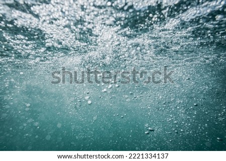 Abstract defocused underwater blue background.