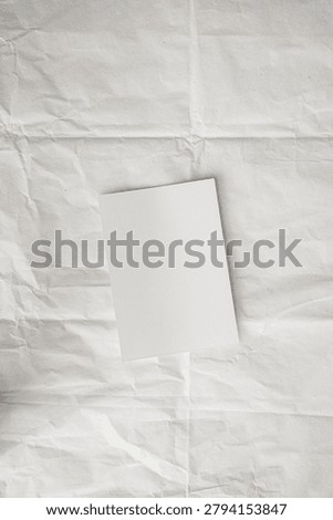 Abstract Design Mockup Featuring Tilted Rectangular Card on Creased Background