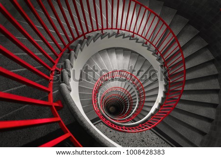 an abstract detail of a spiral staircase in an old building, abstract red and black wallpaper