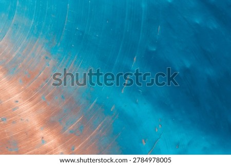 Abstract Diagonal Split Blue Paint and Brushed Copper Metal Background with Circular Machine Scratches and Scuffed Texture