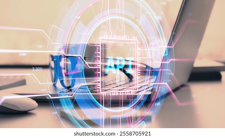 Abstract digital API interface hologram over blurred laptop on a desk, neon elements and lines, concept of software technology