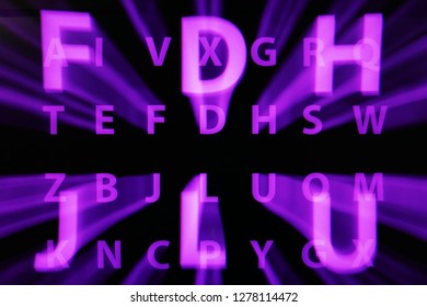 Abstract digital background IT design, the effect of movement on a long exposure of the movement of letters and glowing particles.