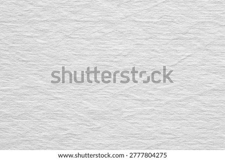Abstract digital noise pattern on a light background with scattered gray pixels