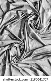 Abstract Draped Silver Metallic Fabric As A Background