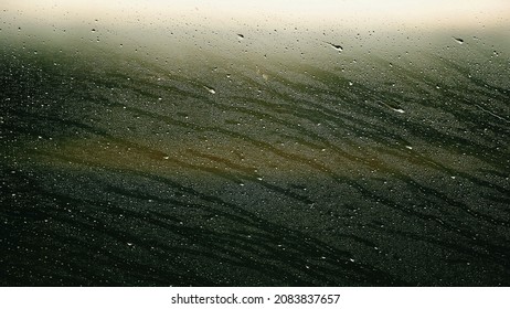 Abstract droplets on window during rainy day on high-speed train