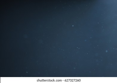 Abstract Dust Particles On Blue Background