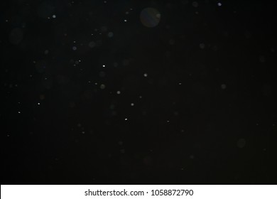 Abstract Dust Particles Over Black Background For Overlay