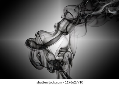 Abstract Eerie Smoke Trails And Shapes On Black Background. Various Designs Ghostly And Alien Styles