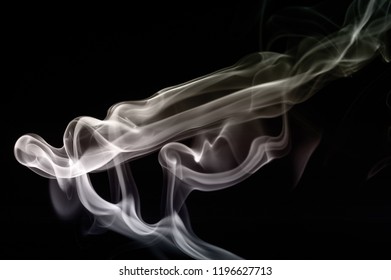 Abstract Eerie Smoke Trails And Shapes On Black Background. Various Designs Ghostly And Alien Styles