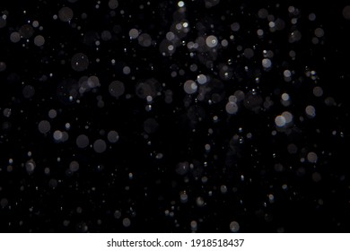 Abstract Elegant Glitter Sparkle Bokeh Defocused On Black Background