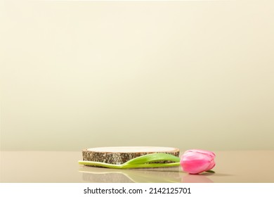 Abstract empty podium of cylinder shape and pink tulips on beige wood background for product. 3D Rendering. Minimal concept. Pedestal for cosmetic product and packaging mockups display presentation