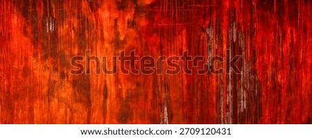 Abstract expressionism is displayed in this background. Various shades of red and orange blend together with drip textures, creating an interesting backdrop with copy-space.