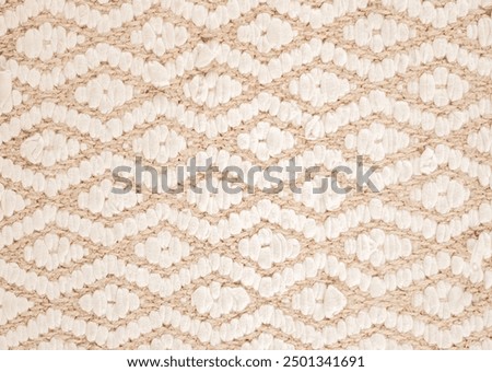 Abstract, fabric geometric pattern beige and white. Rhomboids, zigzags. 