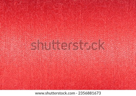 Abstract fabric texture background, close up picture of red color thread, macro image of textile surface, wallpaper template for banner, website, backdrop, poster.