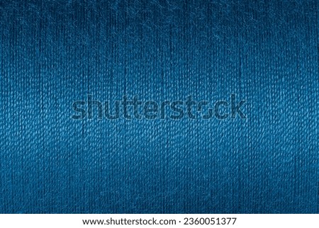 Abstract fabric texture background, close up picture of purssian blue color thread, macro image of textile surface, wallpaper template for banner, website, backdrop, poster.