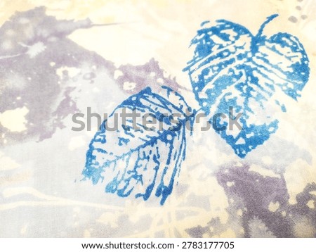 Abstract fabric texture background featuring artistic blue leaf prints with a subtle noise grain effect. Soft watercolor dyed textile pattern with organic botanical elements and noice texture, perfect for design backdrops.